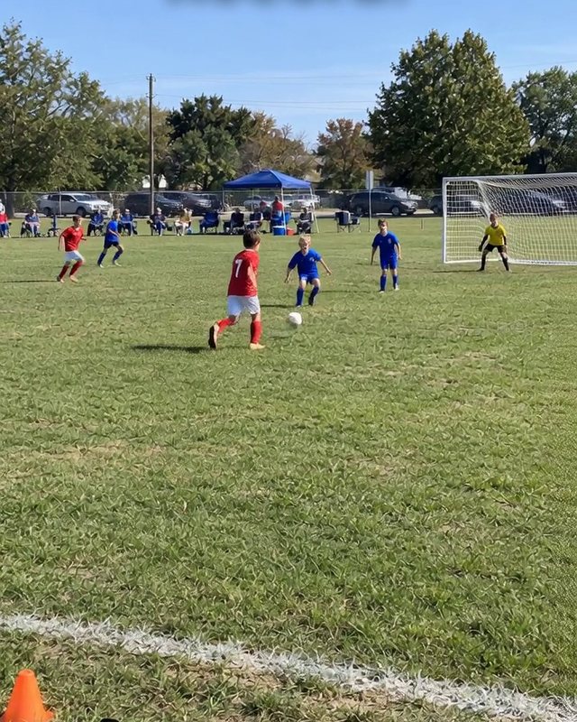 Sideline view of a youth soccer game